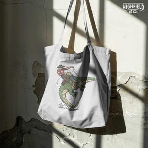 Alligator rodeo graphic PNG with cowboy and rope action for outdoor apparel