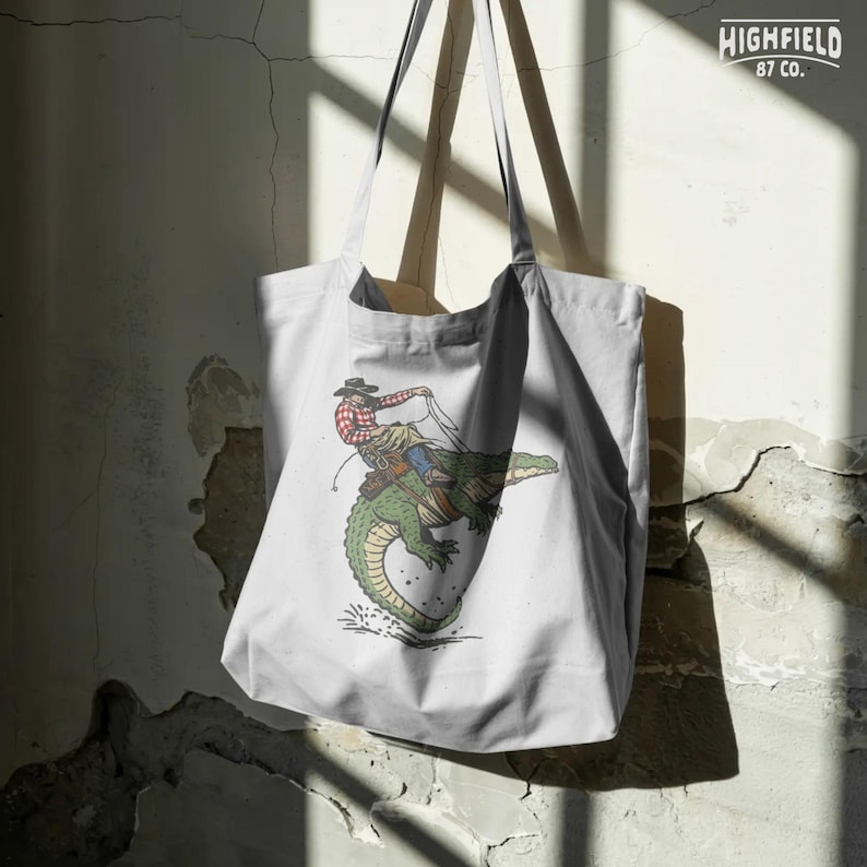 Alligator rodeo graphic PNG with cowboy and rope action for outdoor apparel