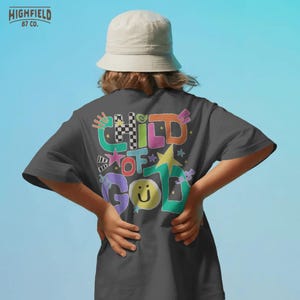 Girls faith PNG featuring a bright Child Of God design with pink, purple, blue, green, orange, yellow, and playful school style.
