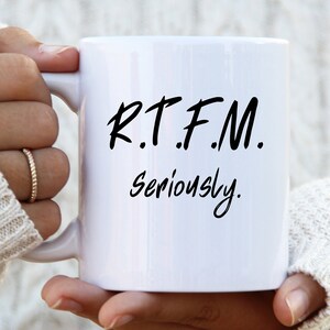May include: White ceramic mug with black text that reads "R.T.F.M. Seriously."