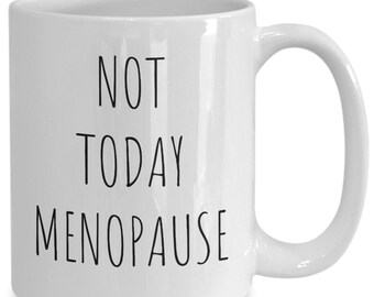 May include: White ceramic coffee mug with black text that reads "NOT TODAY MENOPAUSE".