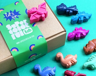 Kleurpotloden in de vorm van kleine dinosaurussen