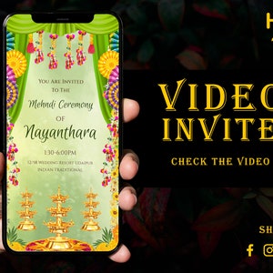 Puede incluir: Un teléfono inteligente muestra una invitación digital para una ceremonia Mehndi. La invitación presenta un diseño verde y dorado con elementos florales y tradicionales indios. El texto en la pantalla dice "Video Invite" y "Check the Video."