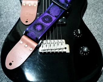 Handmade guitar strap. Flower Power available in 3 colours (Purple, Green, Red) with Seatbelt backing and Montana Hazelnut Real Leather ends