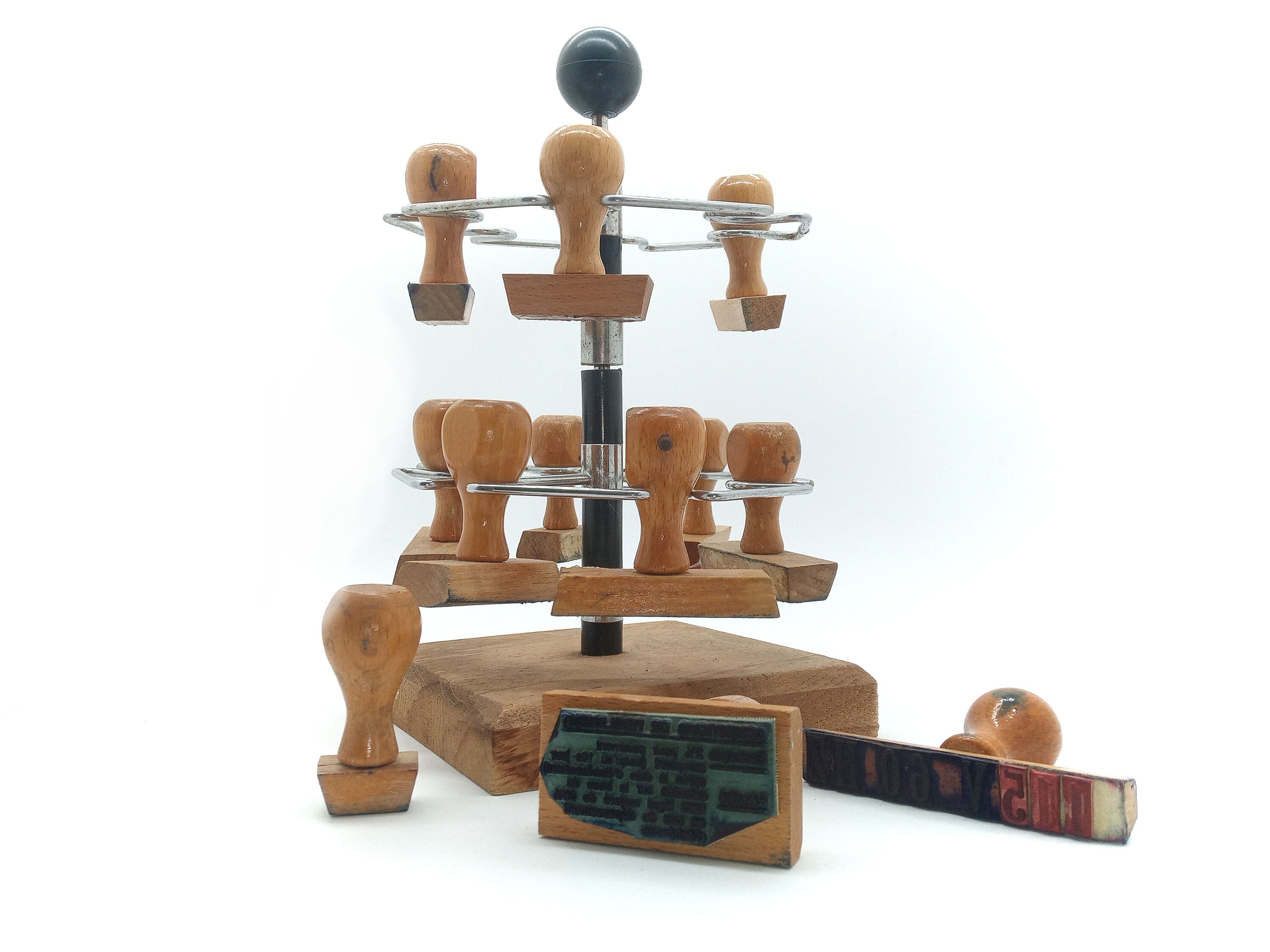 Old industrial rotating ink pad holder with 12 wooden and metal stamps from the 50s/60s