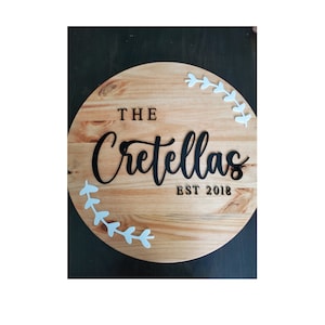 Large family name sign with acrylic wording and embellishments