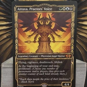 May include: A collectible trading card titled Atraxa, Praetors' Voice, featuring a stylised illustration of a winged creature holding a staff. The card has a black border with gold accents, text detailing game abilities, and a 4/4 power rating.