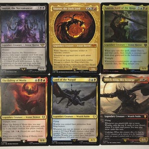 May include: Six Magic: The Gathering trading cards featuring characters from the Lord of the Rings. Cards include "Sauron, the Necromancer", "Sauron, the Dark Lord", "Sauron, Lord of the Rings", "The Balrog of Moria", "Lord of the Nazgûl", and "Witch-king, Sky Scourge".