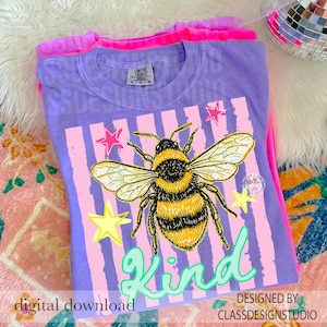May include: A purple t-shirt with a large graphic of a bee, pink stripes, and stars. The word "Kind" is written in a teal script. The text "digital download" and "designed by classdesignstudio" are also visible.