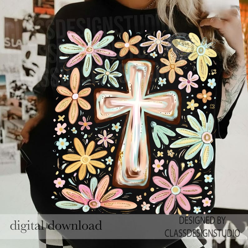 May include: Black t-shirt featuring a floral and cross design. The design includes a large cross in the center, surrounded by colorful flowers in shades of pink, yellow, and blue. The words "digital download" are at the bottom.