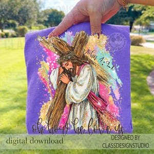 May include: A purple t-shirt featuring a graphic of Jesus carrying a cross, with the text "John 4:9-10" and "Oh how he loves us." The design includes gold glitter accents and colorful paint strokes. The words "digital download" and "designed by ClassDesignStudio" are also visible.