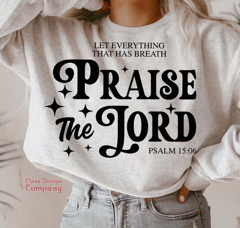 May include: A gray sweatshirt with the text "Let everything that has breath Praise the Lord Psalm 15:06" in black retro-style lettering.