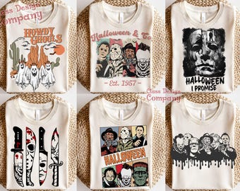 Puede incluir: Seis camisetas de color crema con varios estampados gráficos de temática de terror. Los diseños incluyen fantasmas, personajes icónicos de películas de terror, cuchillos y textos como Howdy Ghouls, Halloween & Co. Est. 1957, Halloween I Promise y Halloween.