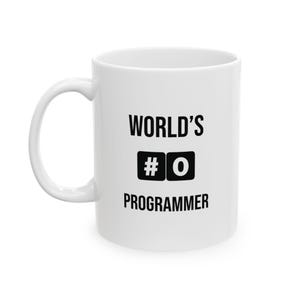 May include: White ceramic mug with the text "WORLD'S #0 PROGRAMMER" in black. The mug has a curved handle and a cylindrical shape. The text is centered on the mug.
