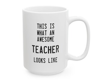 May include: White ceramic mug with a large handle. The mug features the text "THIS IS WHAT AN AWESOME TEACHER LOOKS LIKE" in black, centered on the front. A perfect gift for teachers.