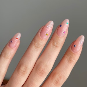 Chrome Stars with Gems Gel Press On Nails JosieGelNails | Chrome Nails, Spring Nails, Fake Nails, Celestial Nails, Emo Nails, Gem Nails