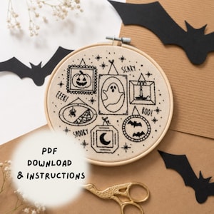 May include: An embroidery hoop containing a cream-colored fabric with black stitched outlines of Halloween-themed frames featuring a pumpkin, ghost, candle, spider web, moon, and bats, with the text EEK, SCARY, SPOOKY, and BOO, plus PDF DOWNLOAD & INSTRUCTIONS.