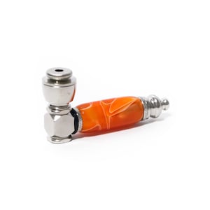 May include: A silver and orange metal pipe with a swirl design on the handle.