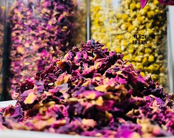May include: A close-up of a pile of dried rose petals in shades of pink and burgundy. The petals are on a white surface, with jars of dried herbs in the background. The text "THE MAZE FEELS" is visible on the right.