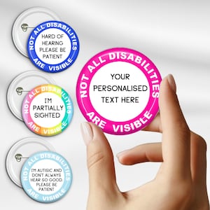May include: A selection of round button badges with white pin backs. The badges display text including "Not All Disabilities Are Visible" and "Your Personalized Text Here". The badges are in various colours, including blue, pink, and rainbow.