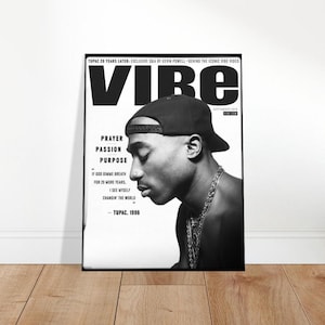 May include: Monochrome poster of Tupac Shakur from Vibe magazine. The image shows a profile of the rapper wearing a cap and chain. Text includes "Prayer, Passion, Purpose" and "Tupac, 1996."