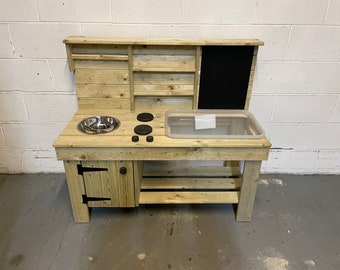 Planed and pressure treated messy play mud kitchen with built in cupboard