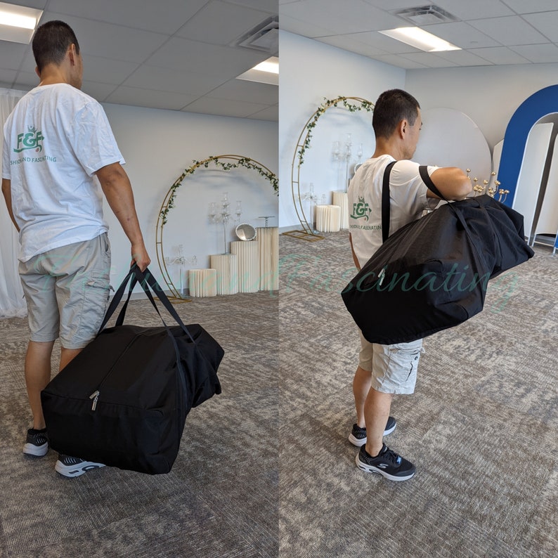 May include: Two people carrying large black duffel bags with zipper closures and adjustable shoulder straps. The bags are made of a durable fabric and have a spacious interior.