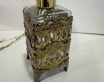 Frasco de tocador de vidrio con filigrana dorada y baño de bronce dorado, de mediados de siglo, década de 1960.