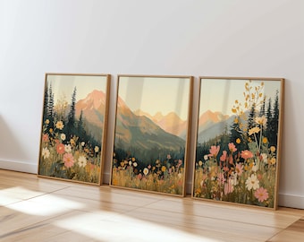 May include: Three framed prints of a mountain landscape with wildflowers in the foreground. The prints are in a light wood frame and have a vintage aesthetic.