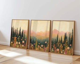 May include: Three framed prints of a landscape scene with a forest in the foreground and mountains in the background. The forest is made up of dark green trees and the mountains are a soft orange and pink color. The foreground of the prints is filled with a variety of flowers in shades of pink, orange, and yellow.