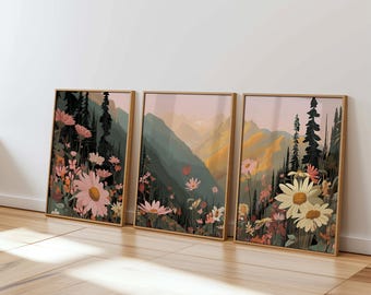 May include: Three framed prints of a mountain landscape with pink and white flowers in the foreground. The prints are in a rustic wooden frame and have a vintage aesthetic.