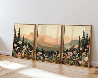 May include: Three framed prints of a watercolor landscape with mountains, trees, and flowers in shades of pink, green, and brown.