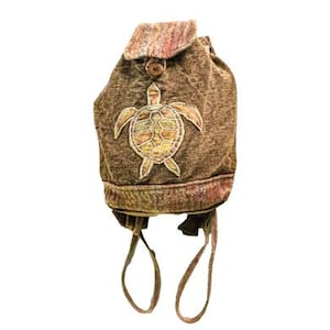 May include: A brown canvas backpack with a sea turtle design. The backpack has a drawstring closure and adjustable straps.