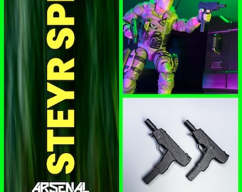 May include: Two black plastic toy guns, one with a black barrel and the other with a silver barrel. The guns are on a white background. The text "STEYR SPP" is in yellow on a green background.