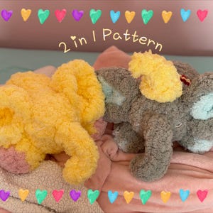 May include: Two plush elephant toys, one yellow and one grey, are displayed on a pink blanket. The yellow elephant has pink accents, while the grey elephant has light blue accents. The text "2 in 1 Pattern" is visible.