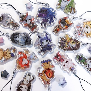 May include: A collection of 15 colorful character charms with black string lanyards. The charms are made of clear acrylic and feature various characters with different expressions and poses.