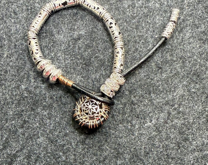 Silver and black Leather bracelet-3mm-barrel knotted bracelet-silver medallion with gold wire wrapping -leather with silver beads-size7