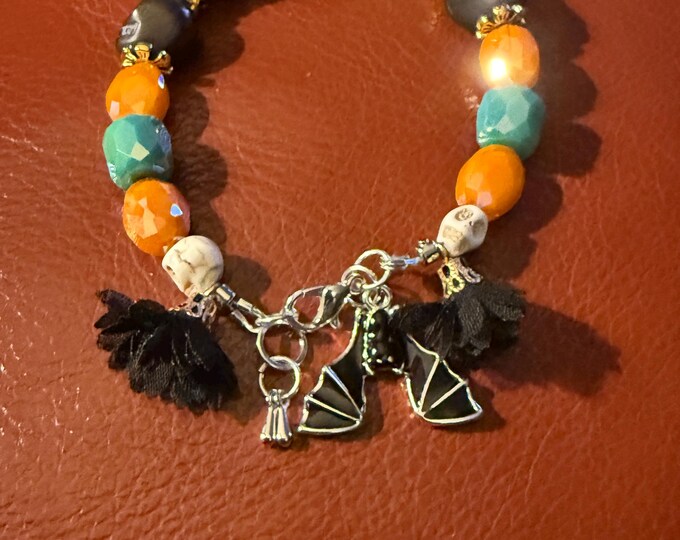 Bling Halloween bracelet-black , orange faceted-size 8-silver lobster hook closure with black bat charm.