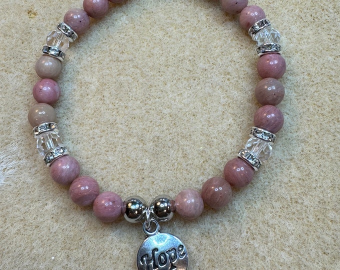 Handmade Cancer or friendship beaded bracelet made out of Rhodochrosite, crystal, and silver rhinestone beads with hope charm.
