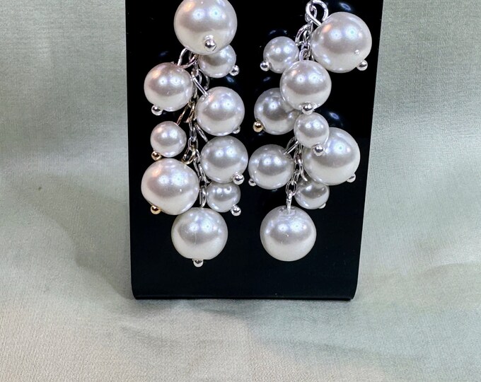Love these handmade 1 1/2” silver wire earrings with several white pearl drop beads and French hook ear wires.
