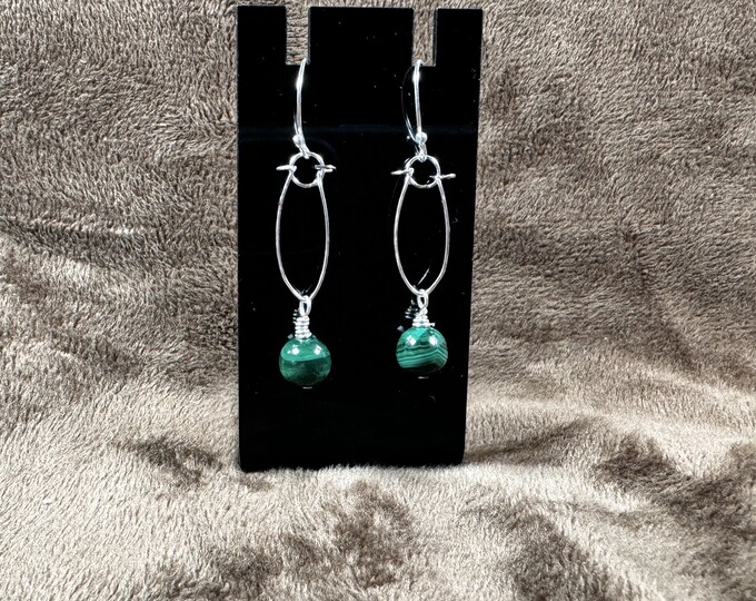 Gifts-Handmade 2” silver wired v-shaped hoop earrings with 1 green Malachite bead and silver wired fish hook ear wires.