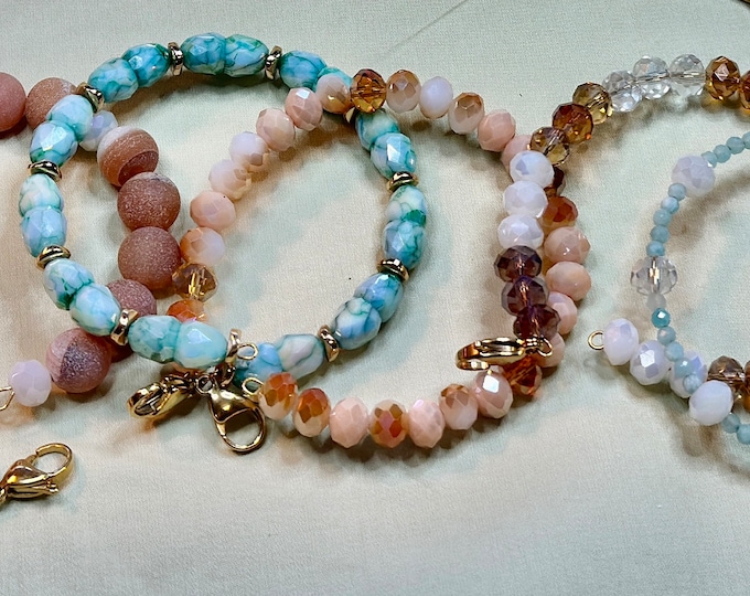 Gifts-Handmade separate memory wire bracelets-sold as set-sold individual-peach and teal colored beads-lobster claw closures