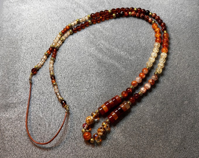 Long 48” orange-themed necklace with large glass beads and leather. Handmade. Could be wrapped twice. Gift for Valentine's Day for her.