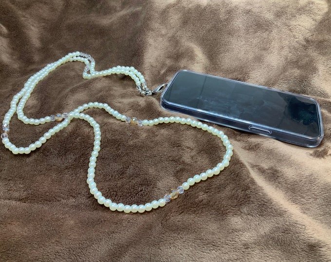 Handmade Phone cross body lanyard with 6mm pearls and crystals complete with a large silver lobster claw closure.