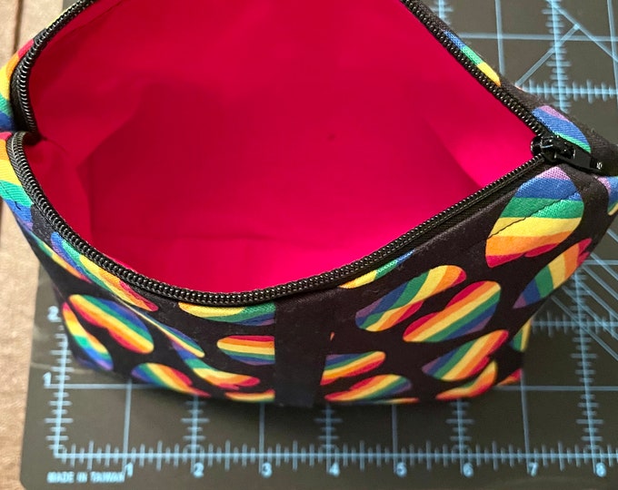 makeup bag-cosmetic bags- toiletries-handmade cosmetic bag with a background in black and rainbow hearts.