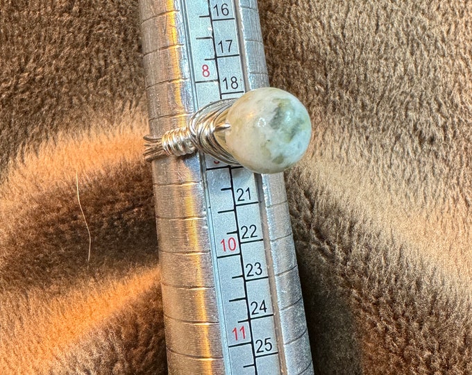 Unique Solitaire ring with 8mm white stone. Wire Wrapped in 20 gauge silver wire. This is a statement ring and handcrafted.