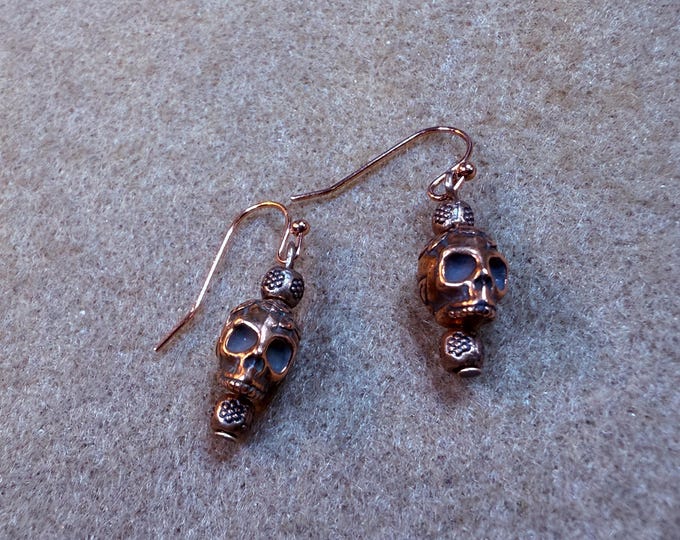 Day of the Dead skeleton earrings-copper skeleton head-3/4” drop-copper French hook ear wire and findings.