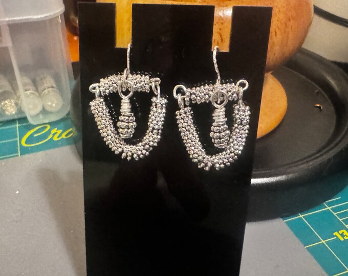 Handmade 1” silver wired spacer beaded earrings.