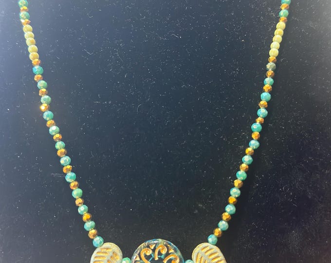 A 24” necklace-glass beads-gold spacers- beads-turquoise and gold faceted beads-magnetic closure-extended chain