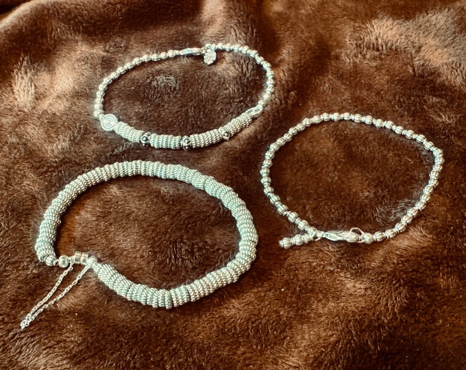 Trío of layered silver beaded bracelets-hard wire, all small beads and facet beads on a magnet closure-Three sizes-handcrafted